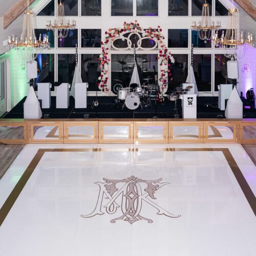 WHITE ACRYLIC FLOOR WITH MIRRORED FACADE AND GOLD MONOGRAM