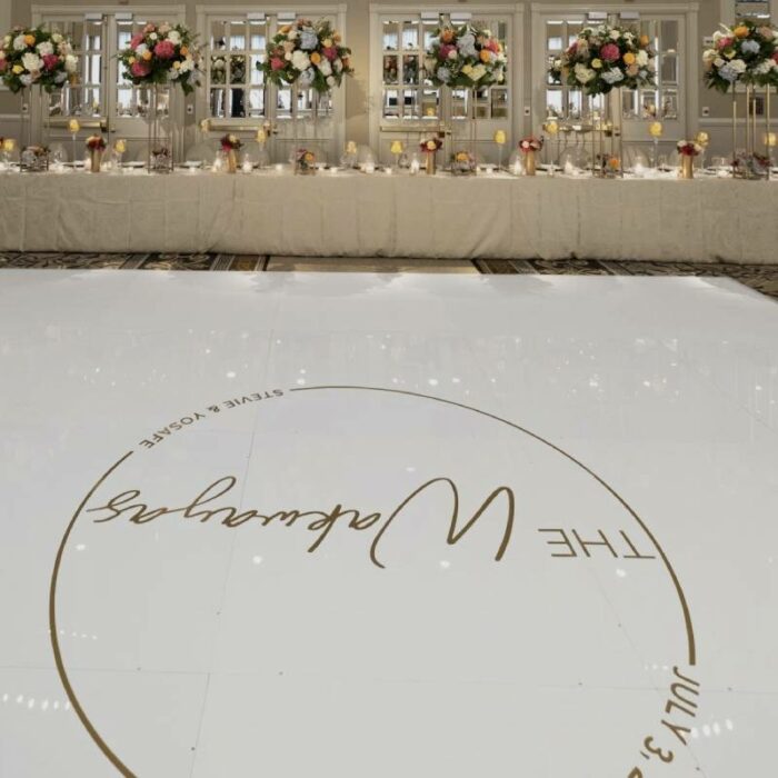 Adolphus Gold Monogram on White Acrylic Floor in High Gloss facing Head Table